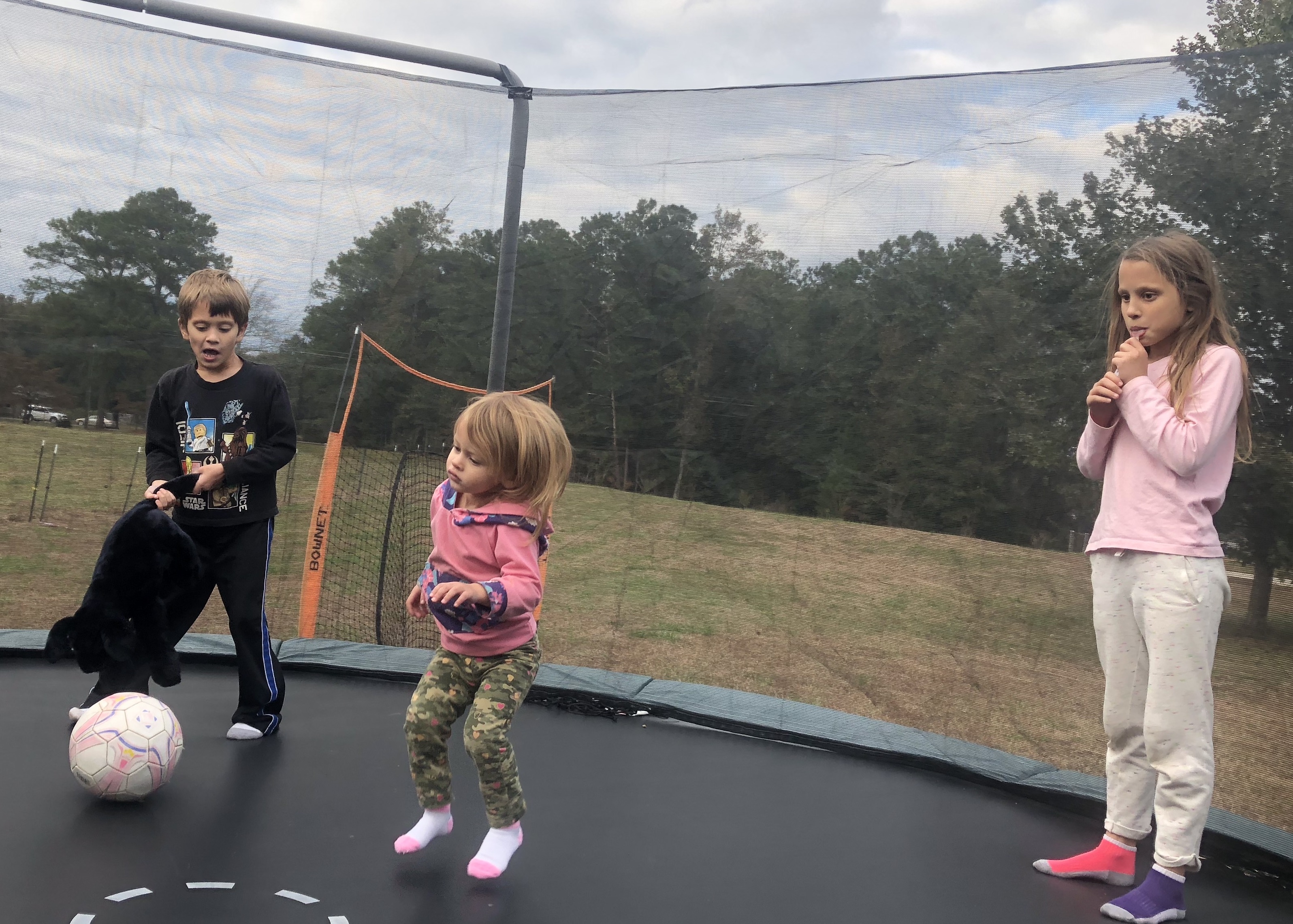 3 weintraub kids on trampoline